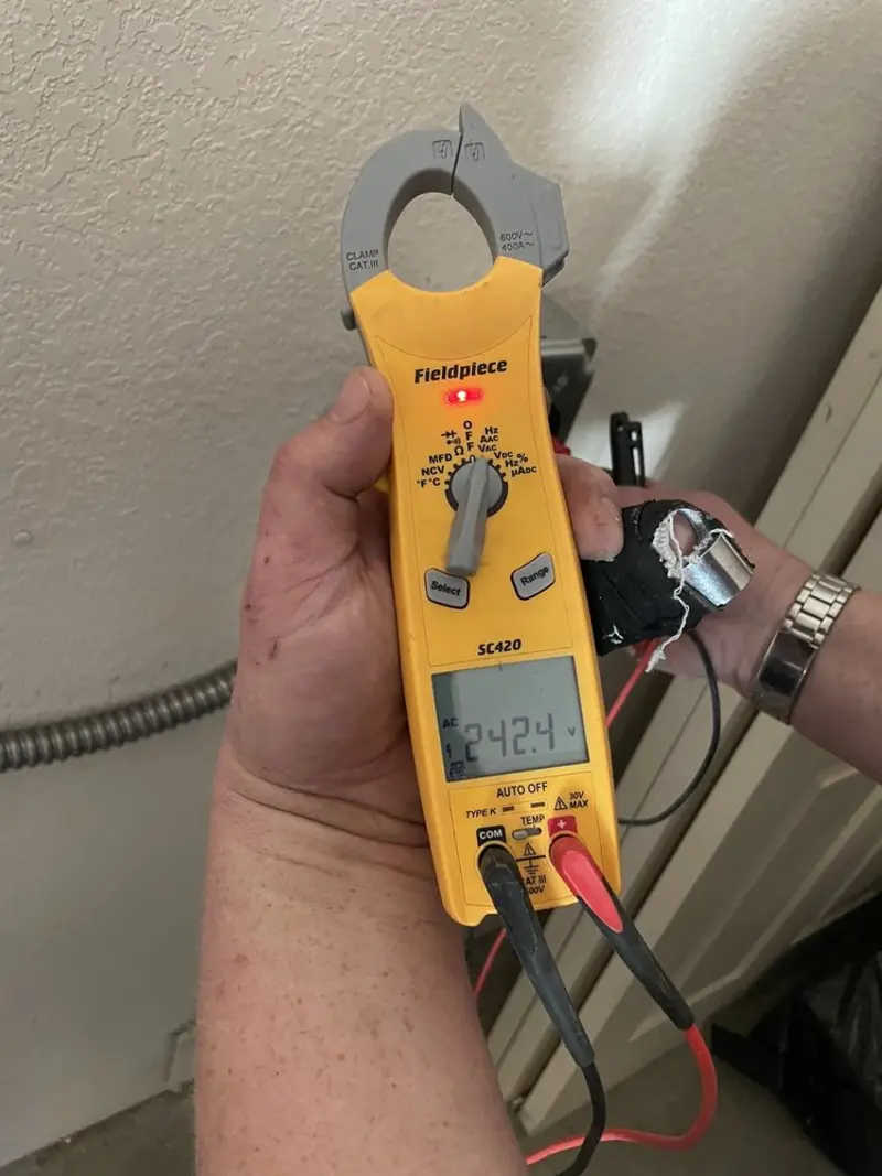 Voltage testing with clamp meter during Electrical Installation Services in Boynton Beach